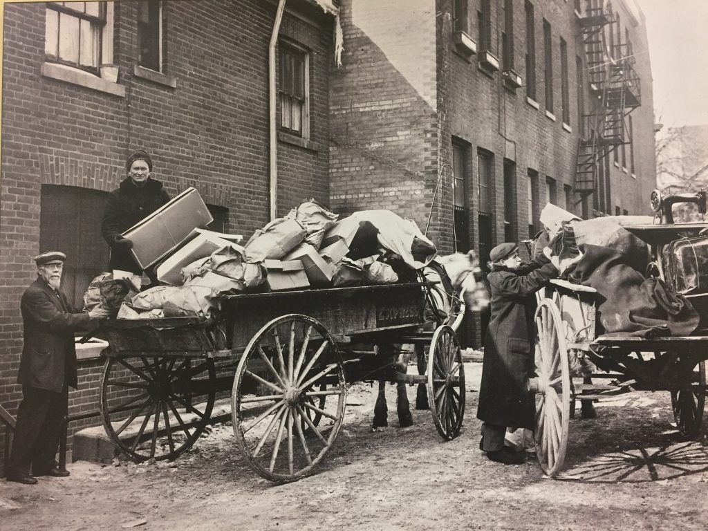 a black and white photo of an old cart 1896