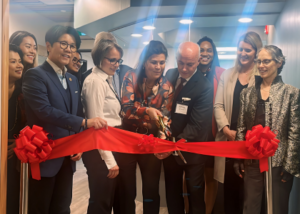 Image of Richard and Lorelai Jenkins cutting the ribbon to open YSM's new health centre for vulnerable youth.