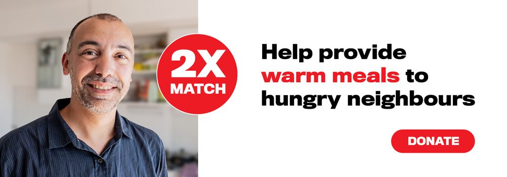 Image of man smiling at camera with caption - Help provide warm meals to hungry neighbours with red button marked donate